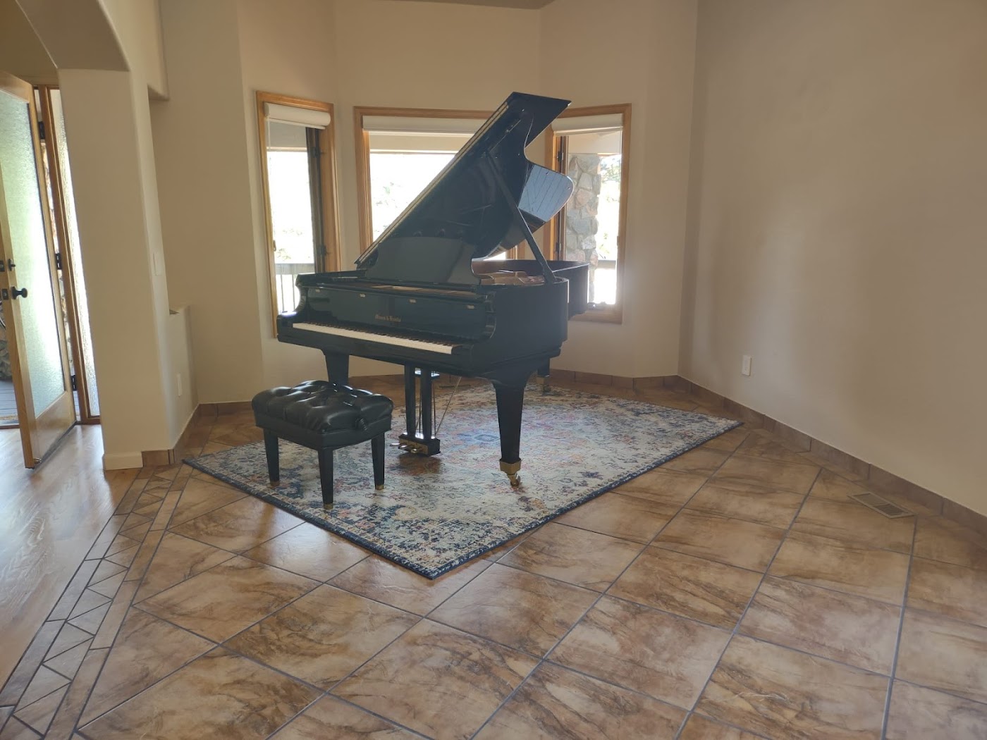 A grand piano inside a home before careful moving